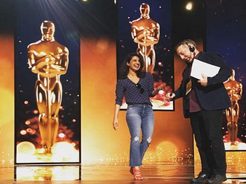 The 33-year-old actress shared a picture from inside the Dolby Theatre in which she is seen practicing on stage along with the Oscars production team. Image courtesy: Priyanka Chopra Instagram