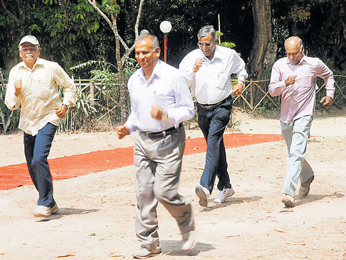 The senior citizens take part in slow walk race in Madikeri on Sunday. dh photo
