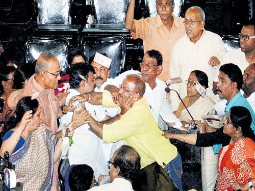 Councillors clash in a melee after Congress and CPM councillors of Kolkata Municipality staged a protest over a TV channel's 'Sting Operation' on TMC leaders in Kolkata on Wednesday. PTI