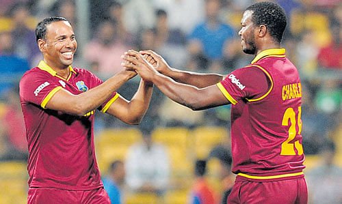 Impressive West Indies' spinner Samuel Badree (left) has been right on the money in the tournament so far. DH FILE PHOTO