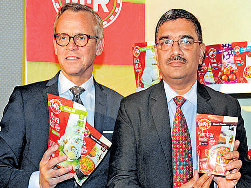 Atle Vidar Nagel-Johansen (left) and Sanjay Sharma launch MTR's new brand identity in Bengaluru on Tuesday. DH Photo