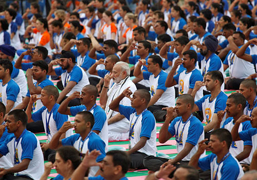 India's Prime Minister Narendra Modi (C) performs yoga during World Yoga Day in Chandigarh, India, June 21, 2016. REUTERS