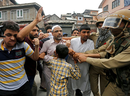 In rebellion mode: Policemen detain Masroor Abbas Ansari (C), leader of the All Parties Hurriyat Conference (APHC) group, during a protest in Srinagar against the recent killings in Kashmir, August 11, 2016. REUTERS
