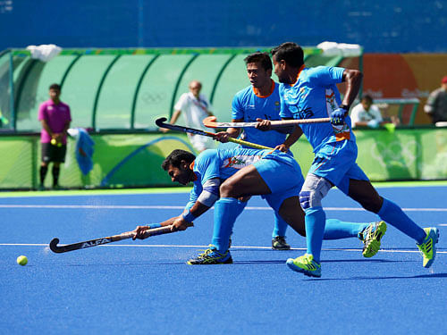 Raghunath Vokkaliga (IND) of India (L) scores his team's first goal. REUTERS