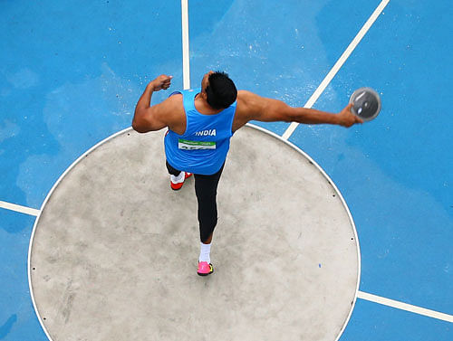 Vikas Gowda of India competes. REUTERS