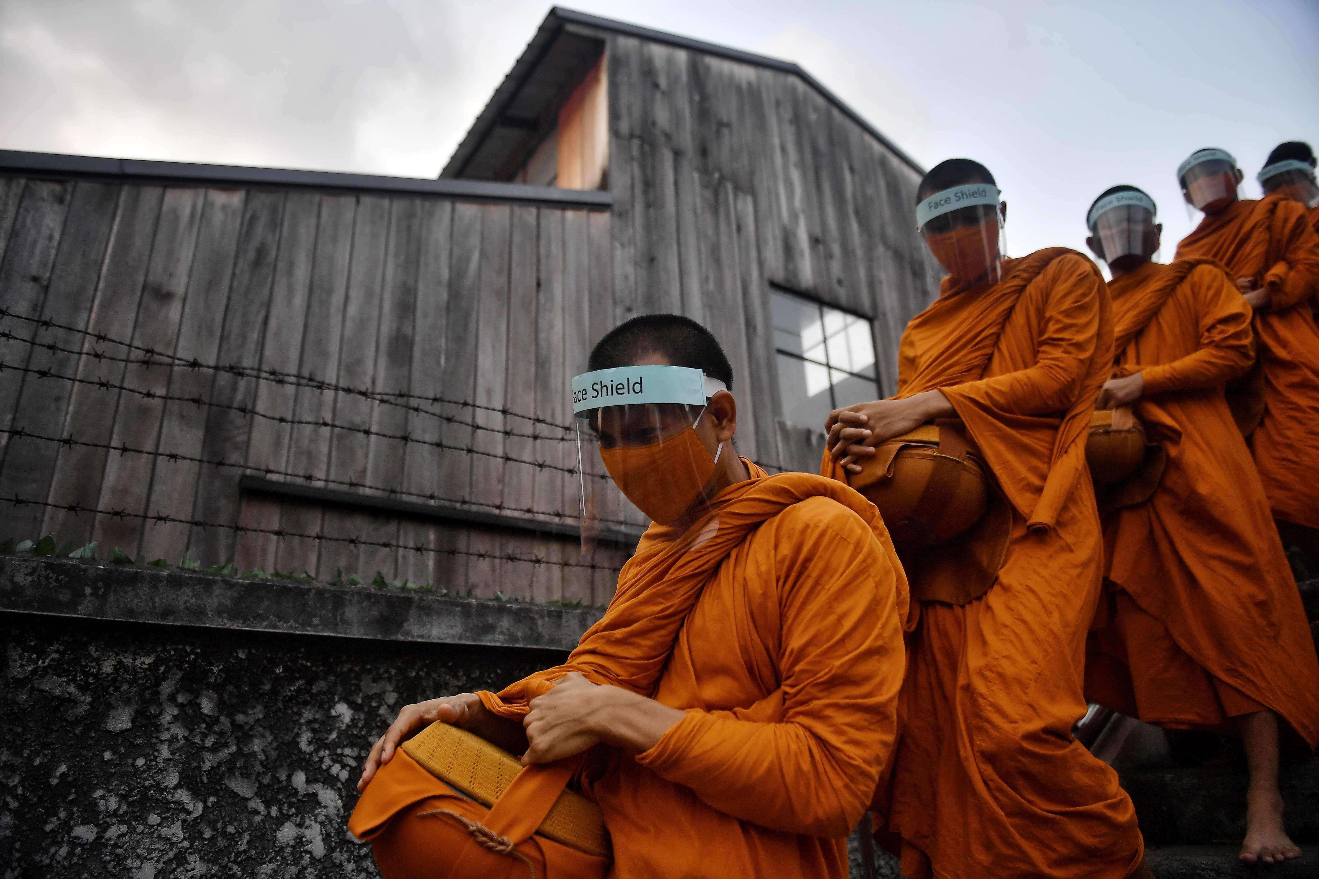 Buddhist monks wear face shields, as a preventive measure against the spread of the COVID-19 in Bangkok. AFP photo