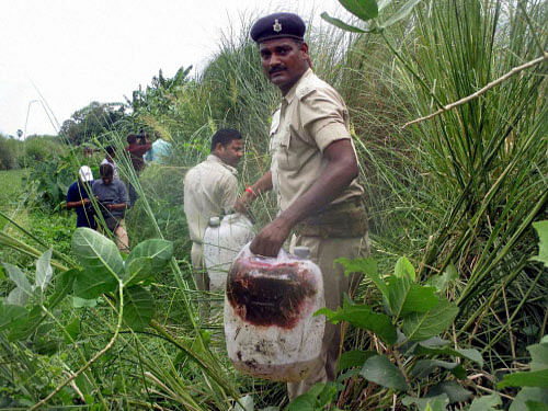 Policemen recoverd poisonous liquor in a field at Harkhua Khajurbari Village in Gopalganj district of Bihar. PTI