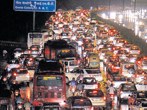 Ahuge traffic jam at ring road after heavy rain inNewDelhi onMonday. PTI
