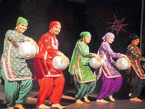 A celebration Women performing the 'Gojari' on stage.