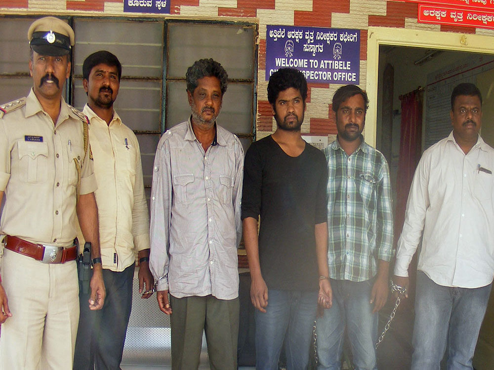 The three men, including an accomplice of forest brigand Veerappan, who were arrested in a murder case. DH Photo