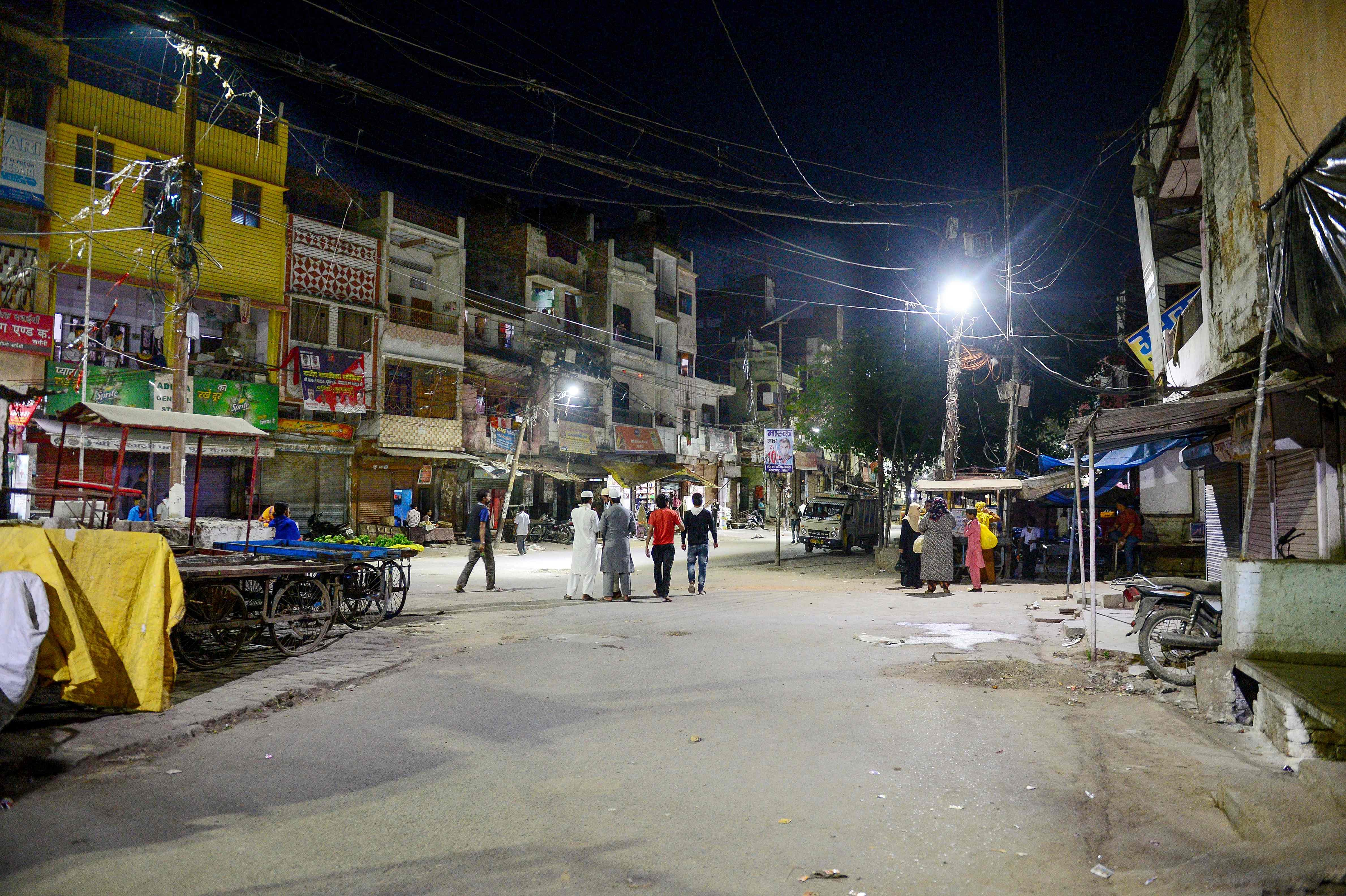 People walk on a deserted street during a government-imposed nationwide lockdown. (Credit: AFP Photo)