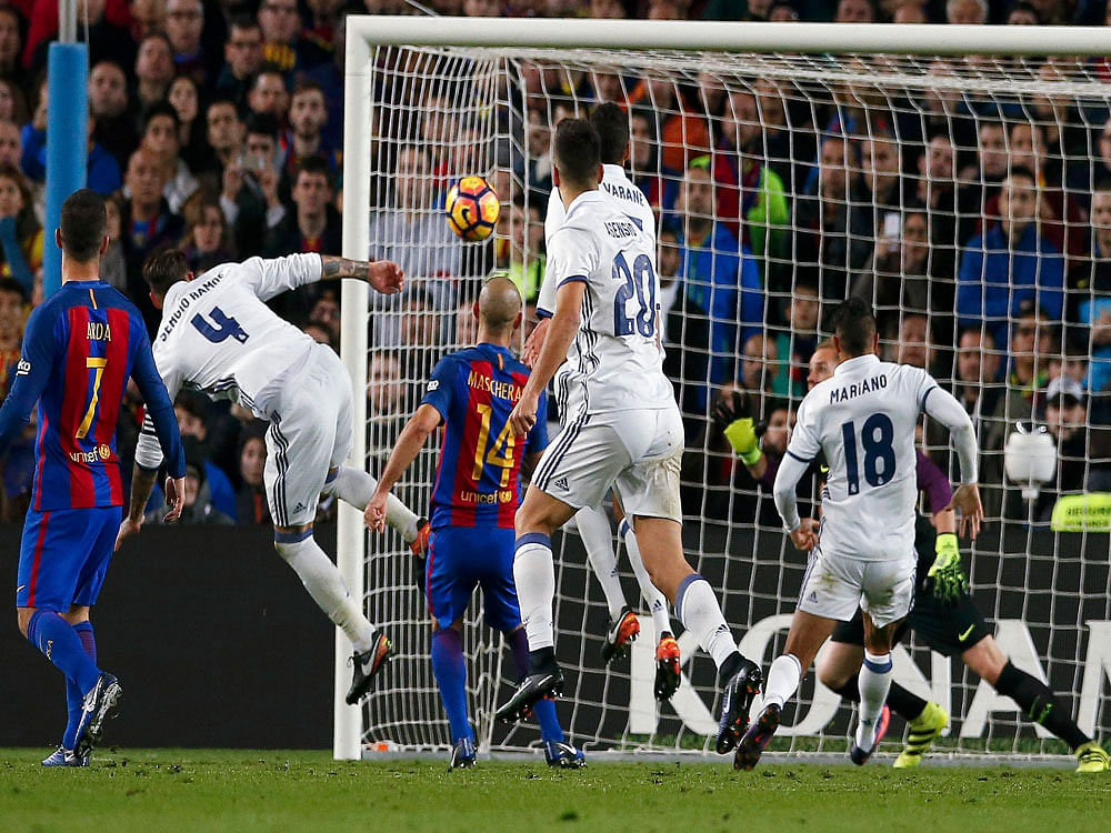 Real Madrid's Sergio Ramos scores a goal during the 'Clasico'. Reuters Photo.