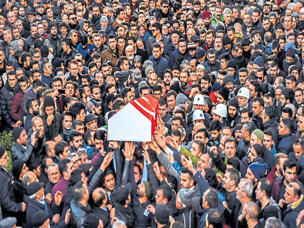 LAST JOURNEY: People carry the coffin of Yunus Gormek, 23, one of the victims of the Reina night club attack, during his funeral in Istanbul. By opening its borders to foreign fighters trying to reach Syria, critics say, Turkey inadvertently supported the rise of the IS.