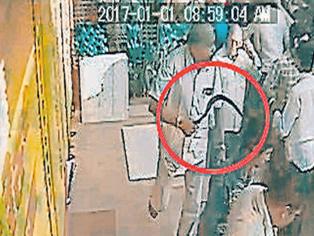 A CCTV camera grab shows armed men barging into Vivek Shetty's house at Ugar Khurd in Athani taluk, Belagavi district.