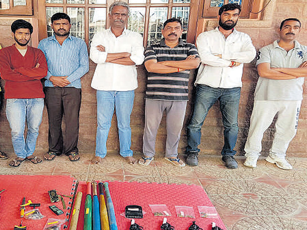 Bachchan (3rd left) and others who were arrested from his house along with firearms.