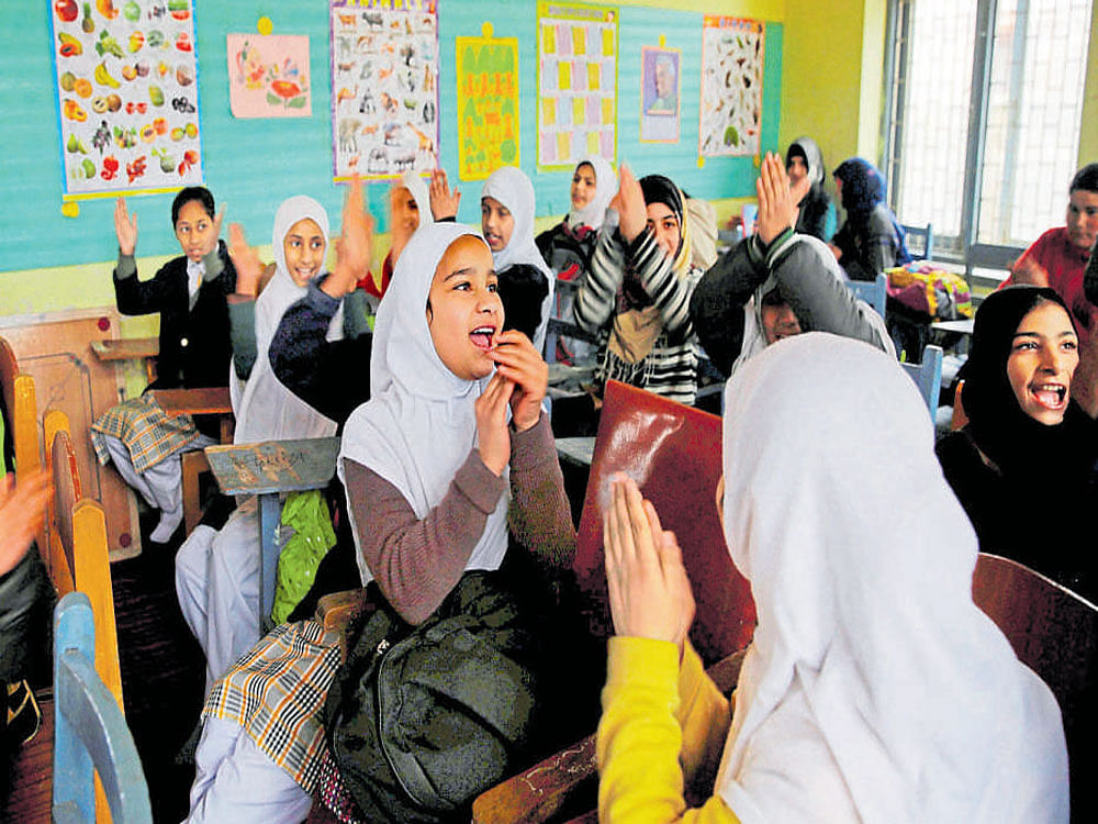 Students in a classroom in Srinagar on Wednesday. PTI