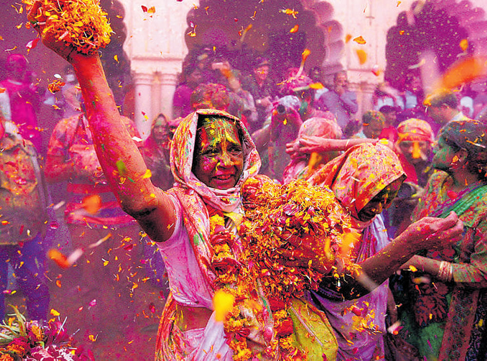 Widows take part in Holi celebrations in the town of Vrindavan in Uttar Pradesh on Thursday. REUTERS
