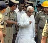 West Bengal Chief Minister Buddhadeb Bhattacharjee having words with Commissioner of Police Goutam Mohan Chakraborty and other police officials during his visit to the Stephen Court on Wednesday. PTI