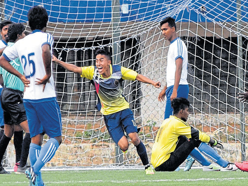 exuberant Neeraj of ASC (centre) celebrates after scoring against Students Union in their BDFA&#8200;Super Division League match on Friday. DH Photo