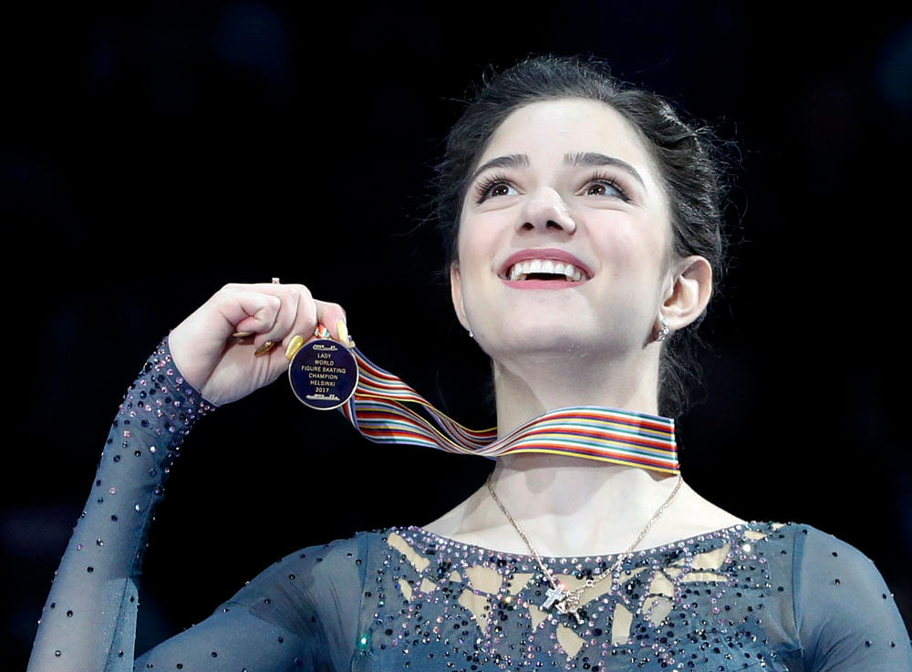 Bright star: Evgenia Medvedeva was calmness personified as she won the World Championship in Helsinki last week with a stunning display. Reuters