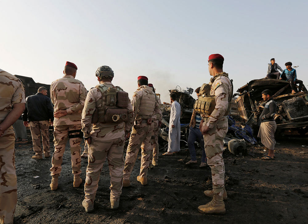 Suicide bombers kill 31 in Iraq's Tikrit: officers