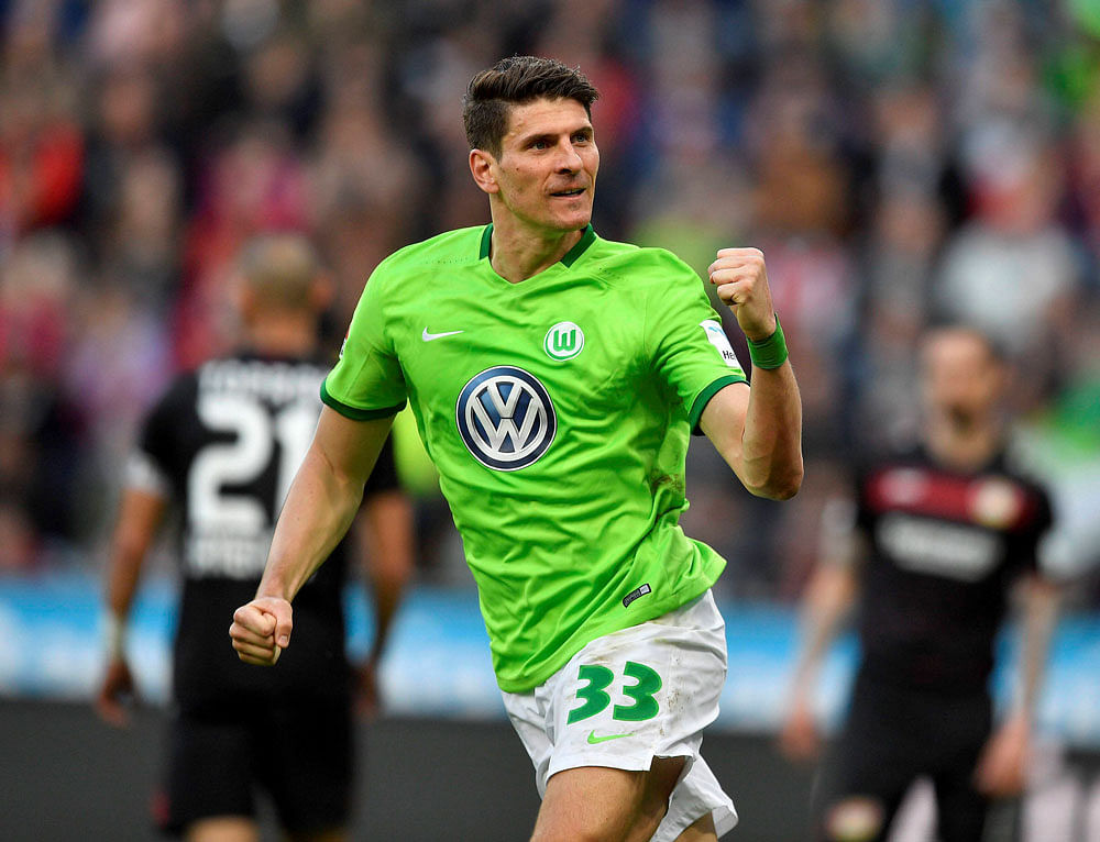 Changing trend: Wolfsburg's Mario Gomez celebrates after scoring against Bayer Leverkusen in a Bundesliga game last week. PTI