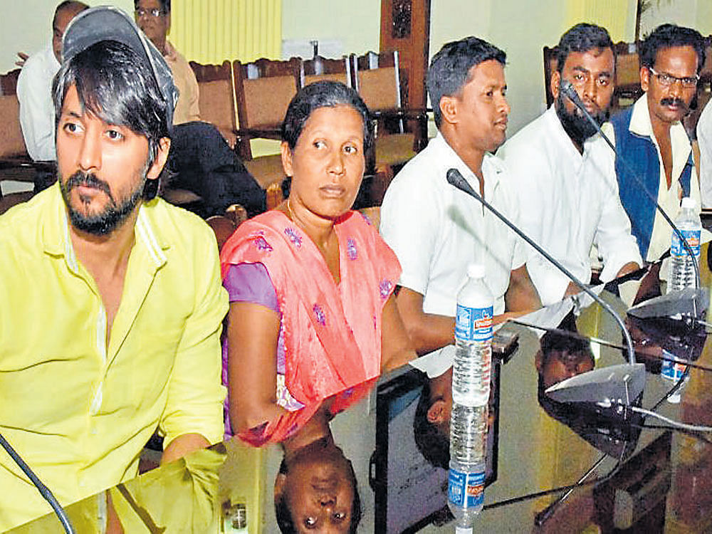 Actor Chetan and residents of Diddalli, Kodagu district, attend a meeting on the rehabilitation of the tribals, at Vidhana Soudha in Bengaluru on Tuesday. DH photo