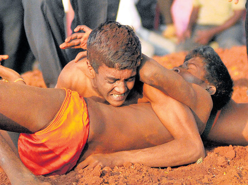 Two young wrestlers battle for honours in an event. DH file photo