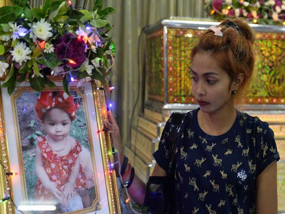 The Buddhist ceremony on the southern island of Phuket concluded a week of funeral rites for baby Natalie, who was hanged from the side of an abandoned building on Monday by her 20-year-old father Wuttisan Wongtalay. REUTERS/Sooppharoek Teepapan
