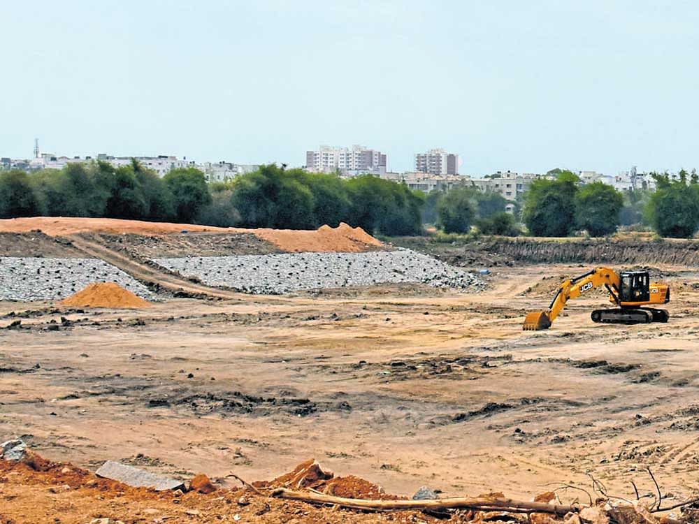 Madiwala lake's boundary is being extended by adding a water catchment area. DH photo
