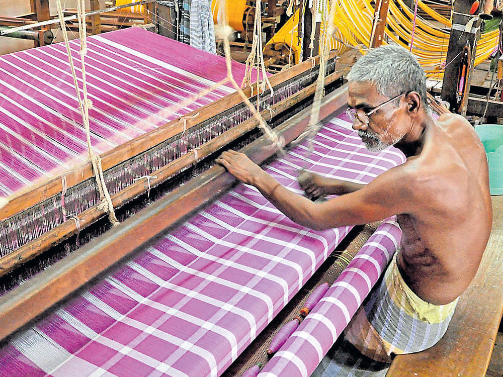 threads of life: A weaver at work. Photo by Bharat Kandakur, Anandateertha Pyati, G Krishna Prasad
