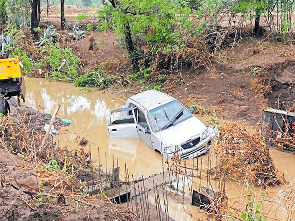 The vehicle which was washed away in Anavala stream of Kaladagi hobli, Bagalkot district late on Tuesday night.  DH&#8200;photo