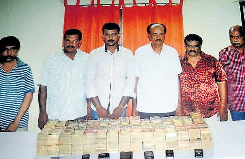 The six men arrested by the Mico Layout police for trying to exchange Rs 2.8 crore in demonetised currency.