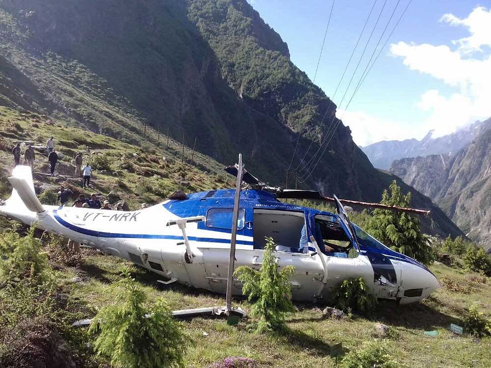The police officer said the helicopter got disbalanced while taking off due to insufficient air pressure and fell down. ANI Photo