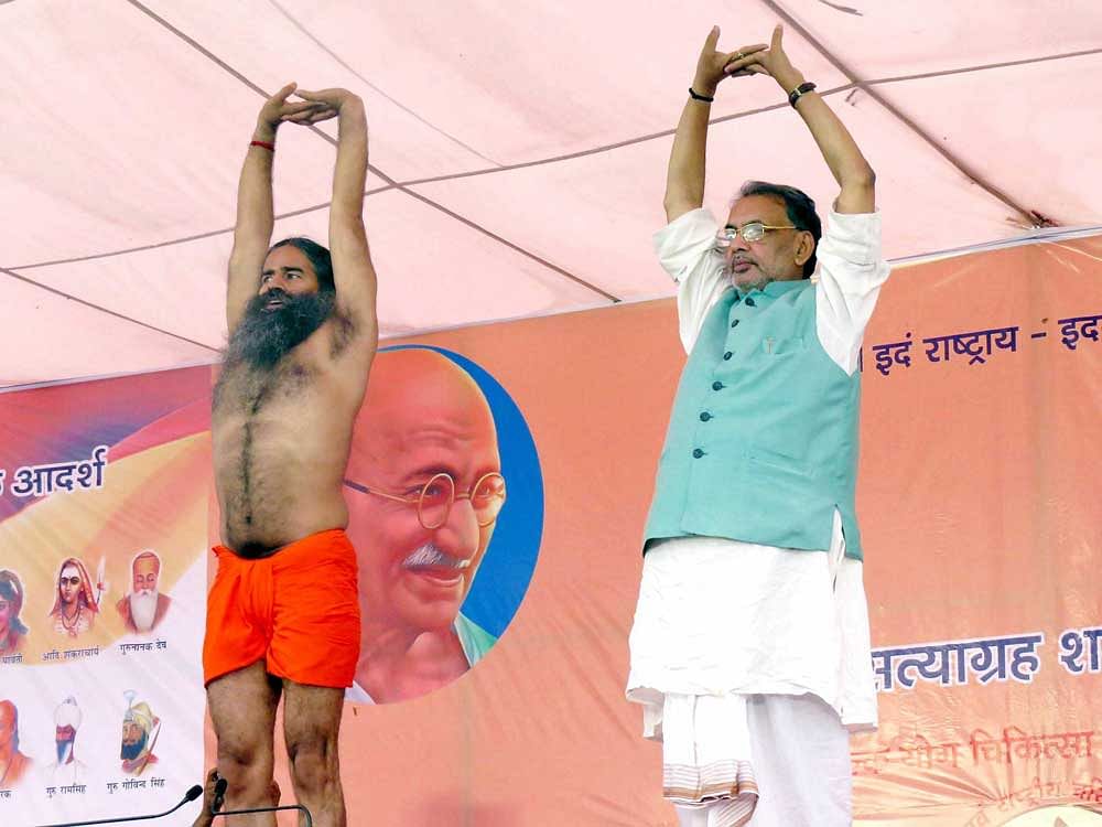 At a three-day yoga event organised by Baba Ramdev in Motihari on June 8, Singh was seen doing yoga in his company. File photo.