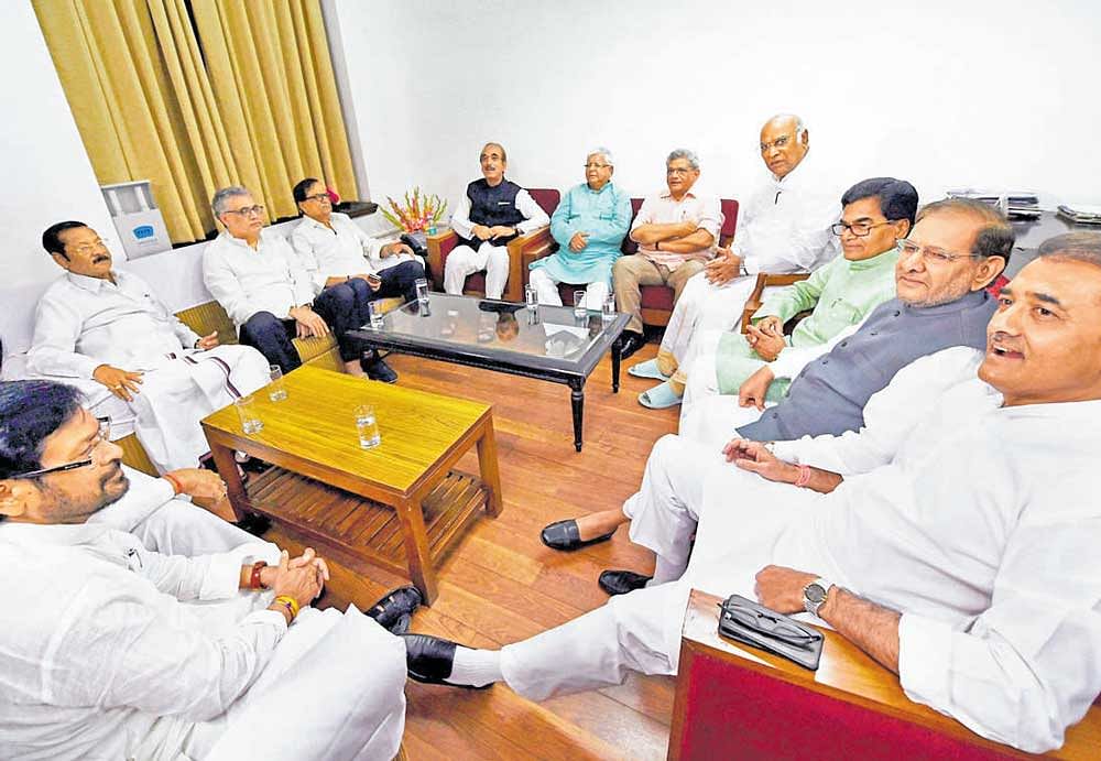 Senior Congress leaders Ghulam Nabi Azad and Mallikarjun Kharge, CPM general secretary Sitaram Yechury, RJD leader Lalu Prasad, Samajwadi Party's Ramgopal Yadav, JD(U) leader Sharad Yadav, NCP's Praful Patel and other opposition leaders in a meeting to discuss the strategy for the upcoming Presidential election, in New Delhi on Wednesday. PTI