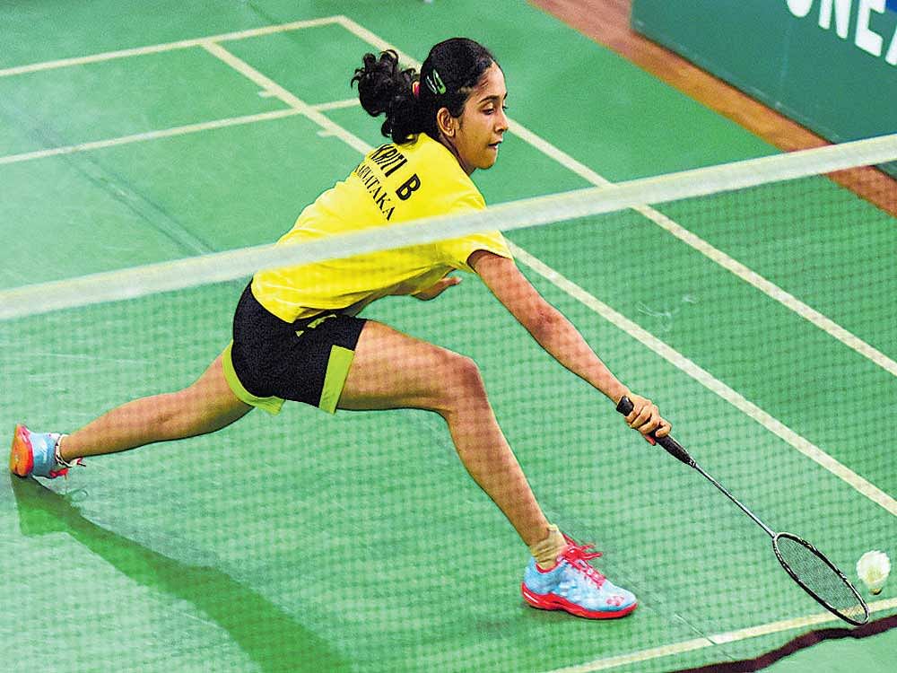 Deft: Karnataka's Kriti Bharadwaj ateempts to recover a drop shot during her round of 64 clash on Thursday. DH PHOTO