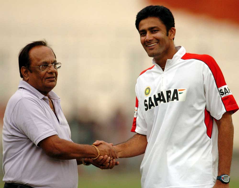 Former India off-spinner Erapalli Prasanna congratulating former Indian coach Anil Kumble on his 450th wicket during the nets practice session at Eden Gardens, Kolkata. DH File photo