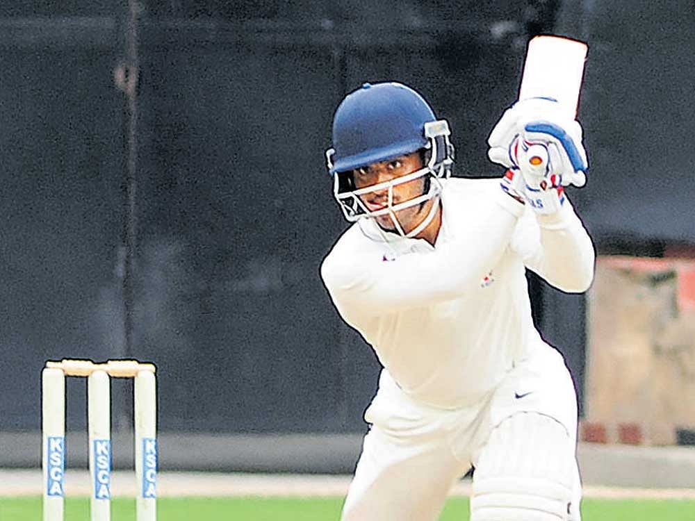 STYLISH KSCA Colts' Naga Bharath drives one to the fence en route to his 101 against Dr DY Patil Academy. DH PHOTO