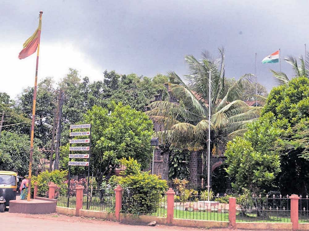 The national flag has been hoisted atop the office of the regional commissioner in Belagavi, while the Kannada flag is seen on the road in front of the office. They are almost 50 metres apart, but an activist of the MES&#8200;says the flag code has been violated. dh photo