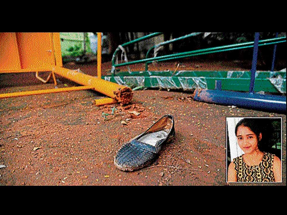 The solitary shoe of 13-year-old girl Priya Gowda (inset) lies alongside playground equipment in the BBMP park in MVJ Layout, Mahadevapura, on Sunday. The girl died after a slide crashed on her on Saturday. DH PHOTO/Kishor Kumar Bolar