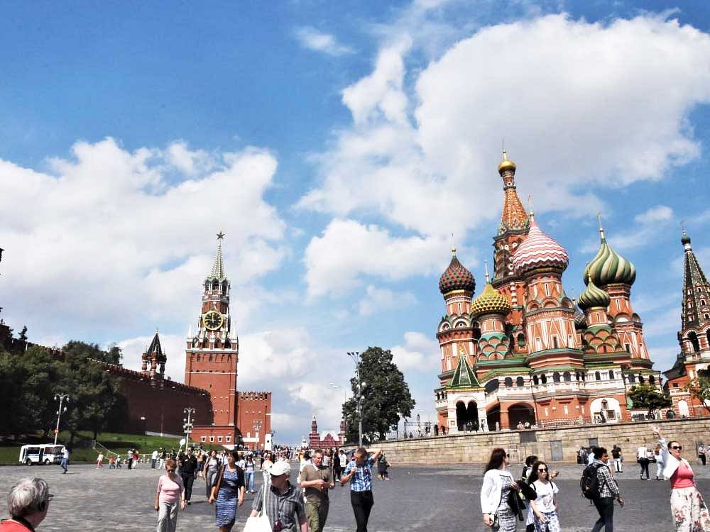 Majestic St Basil's Cathedral at Red Square and (below) A metro station in Moscow.