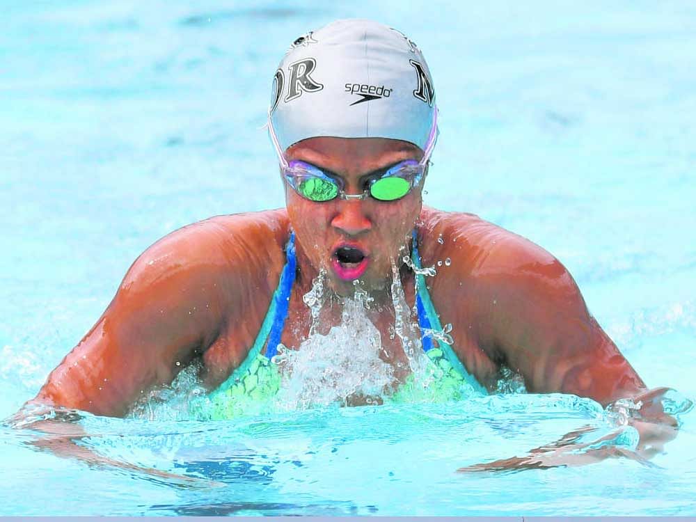 POWERING THROUGH Saloni Dalal wins the 200M breaststroke in the State Aquatic Championships at the Dolphin Aquatic Centre on Thursday. DH PHOTO