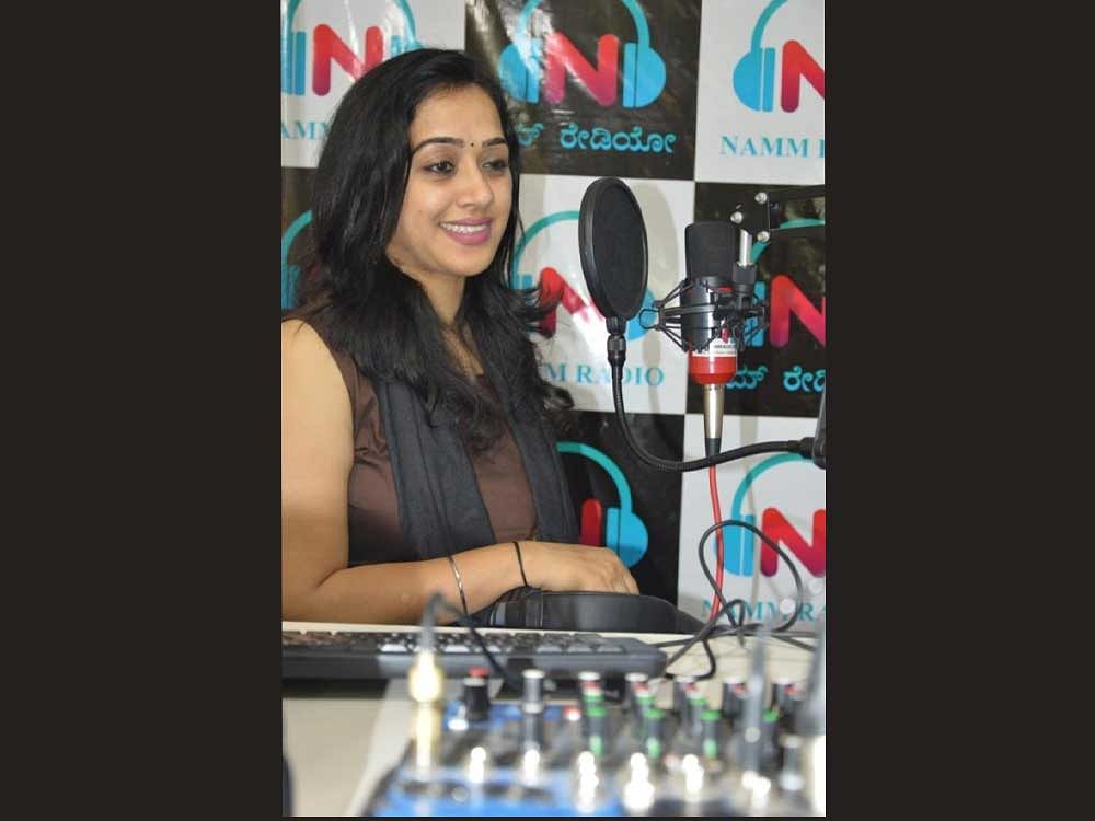 RJ Roopa presenting a show at the NammRadio studios in Bengaluru. DH photo.