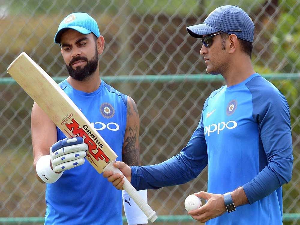PAST AND PRESENT Indian captain Virat Kohli (left) and Mahendra Singh Dhoni during a practice session in Dambulla on Friday. AFP