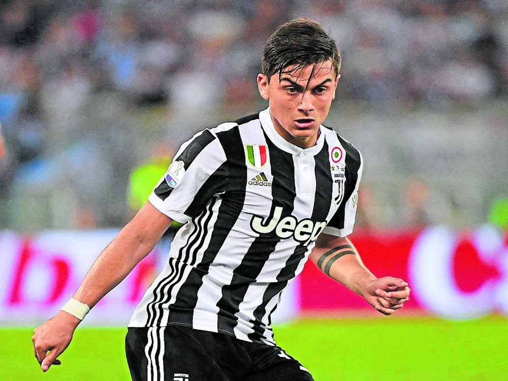 young gun: Many feel Paulo Dybala can step into the role that Lionel Messi dons in the Argentina team. AFP