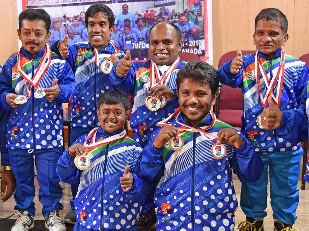 Worthy winners: Medal winners of the World Dwarf Games: (From left) BACK ROW: Renu Kumar, Shantha Kumar, N Nagesh, Devappa More. FRONT ROW: C V Rajanna, Prakash M. DH photo
