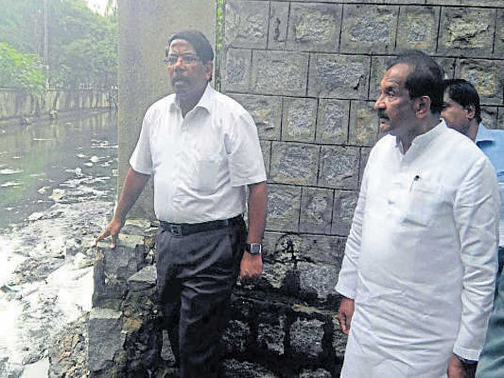 Bengaluru Development Minister K J George with BBMP Commissioner N Manjunath Prasad during the inspection of rain-affected areas at Shanthinagar on Saturday