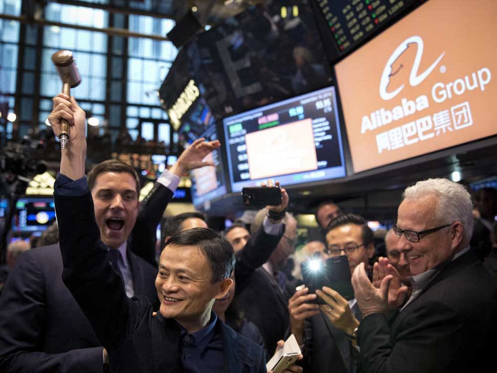 Jack Ma, founder of the Alibaba Group, holds a gavel on the New York Stock Exchange floor ahead of the Chinese e-commerce giant's initial public offering. NYT