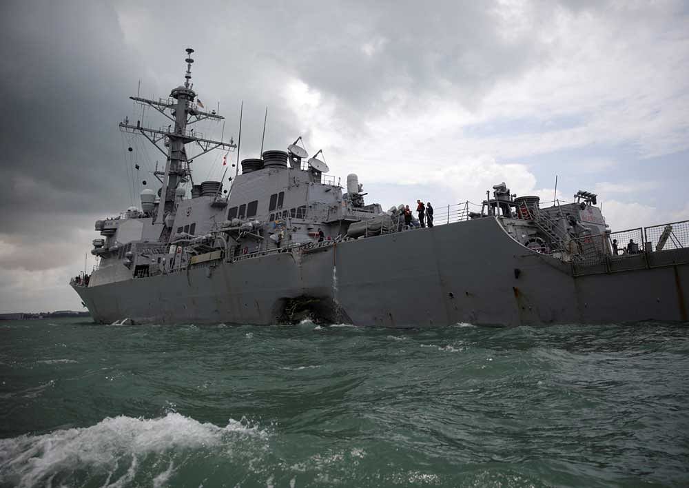 The U.S. Navy guided-missile destroyer USS John S. McCain is seen after a collision with a tanker off Singapore. Reuters photo.